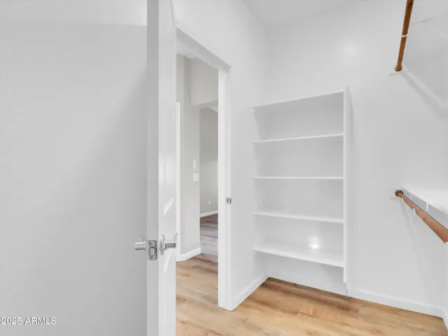 a bathroom with a double vanity sink mirror and shower