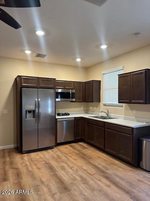 3405 West Alta Vista Road Phoenix, AZ 85041 - Photo 26 of 40 a large kitchen with a large counter top stainless steel appliances and cabinets