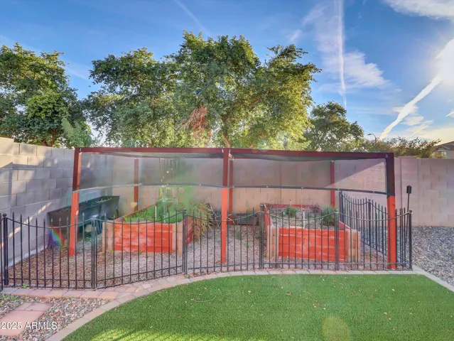 a front view of a house with swimming pool having outdoor seating