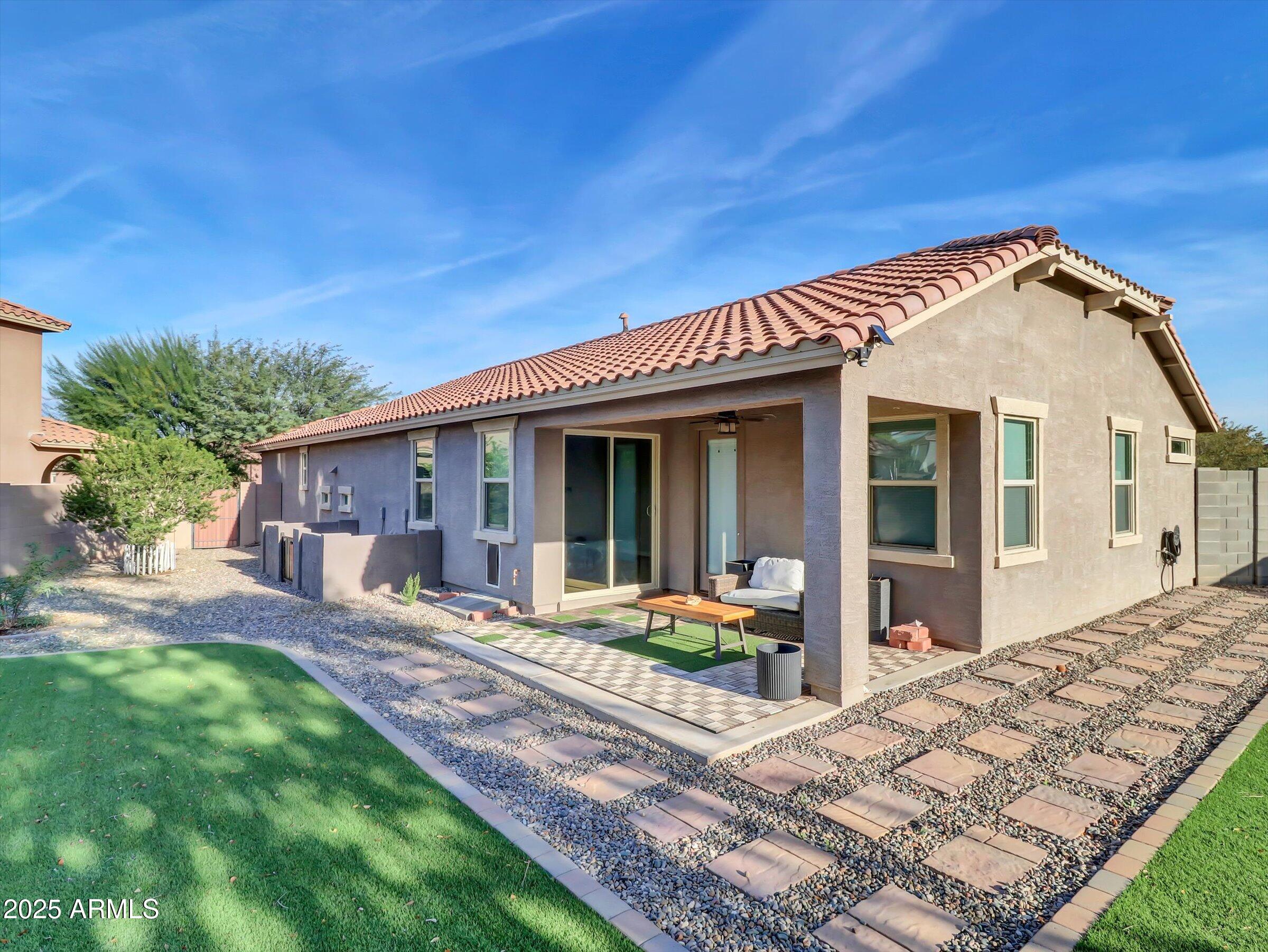 3405 West Alta Vista Road Phoenix, AZ 85041 - Photo 7 of 40 a front view of a house with a yard