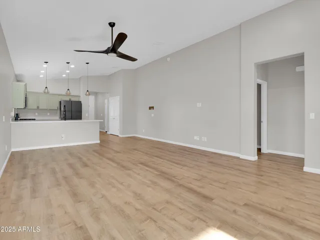 a view of a kitchen with a sink and a window