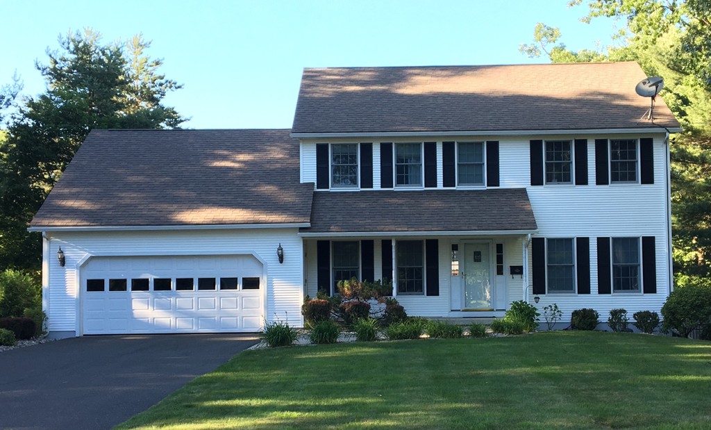 669 Shaker Road Longmeadow, MA 01106 - Photo 1 of 28 a front view of a house with a garden and yard