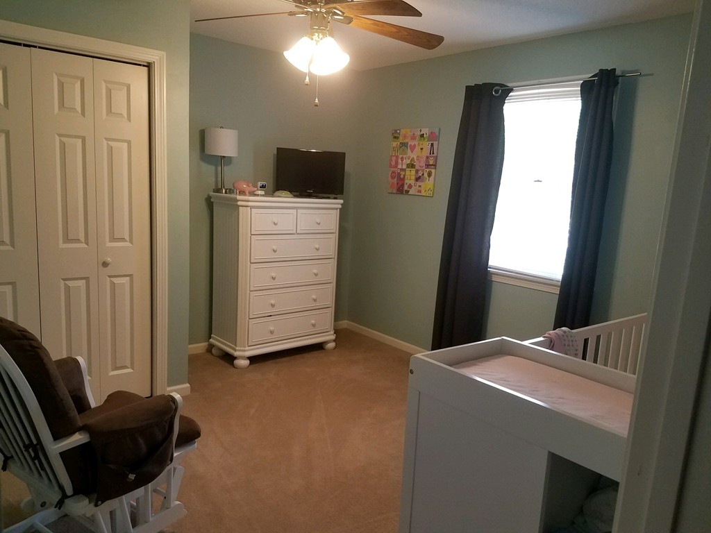 669 Shaker Road Longmeadow, MA 01106 - Photo 19 of 28 a view of a livingroom with furniture and staircase