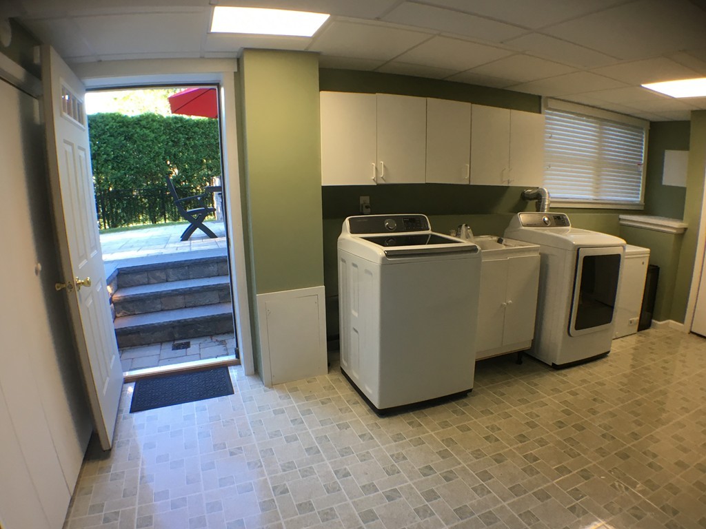 669 Shaker Road Longmeadow, MA 01106 - Photo 26 of 28 a utility room with sink dryer and washer