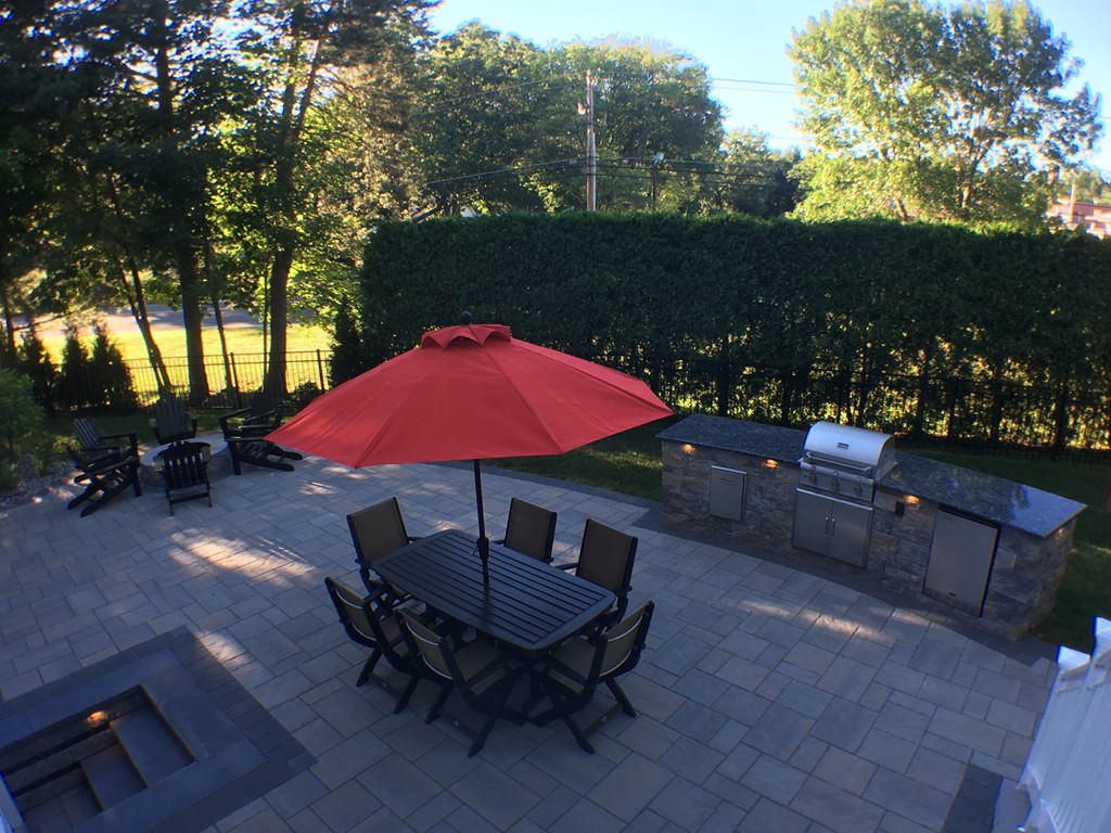 669 Shaker Road Longmeadow, MA 01106 - Photo 5 of 28 an outdoor space with furniture and umbrella
