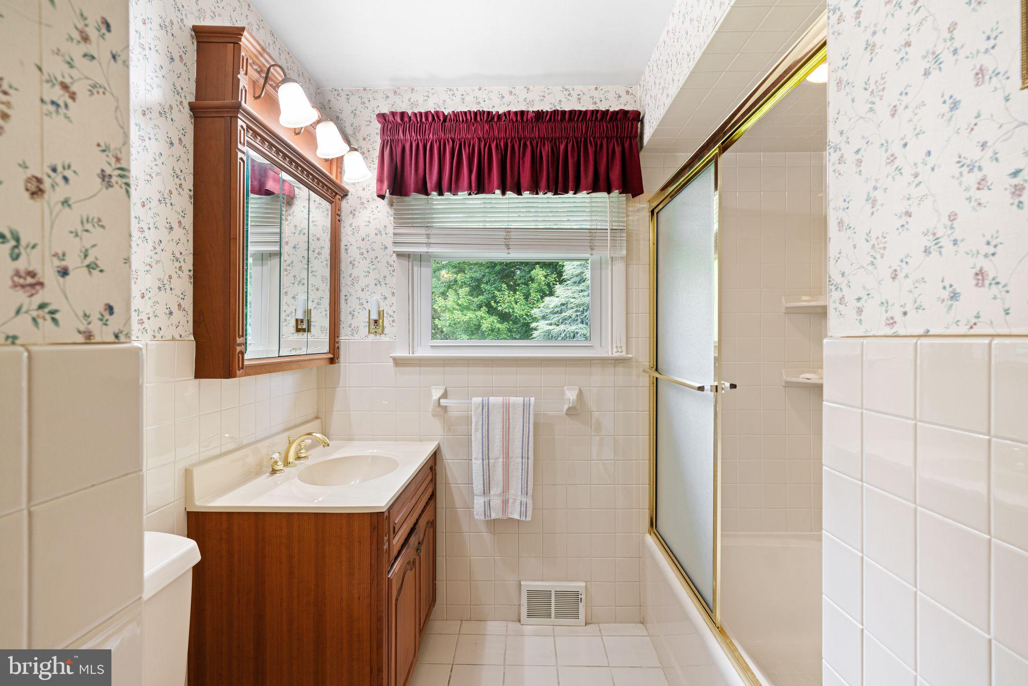 604 Davis Road Barrington, NJ 08007 - Photo 14 of 30 a bathroom with a sink and a mirror