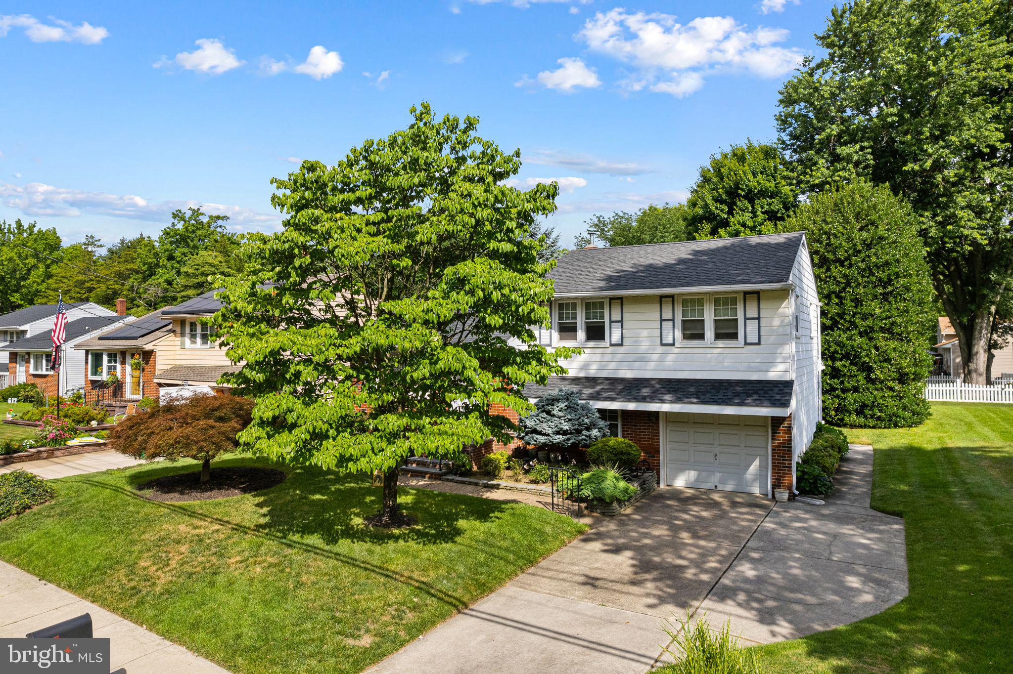 604 Davis Road Barrington, NJ 08007 - Photo 2 of 30 a front view of a house with a garden