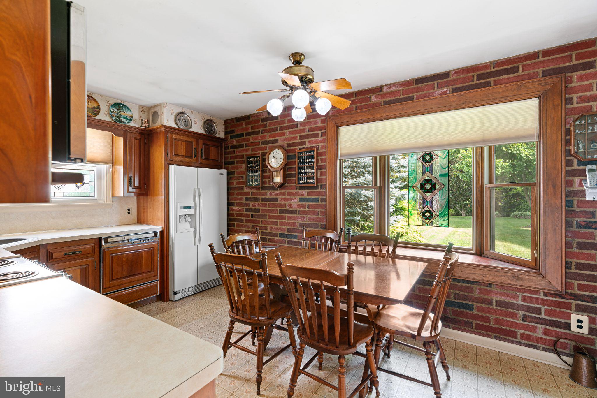 604 Davis Road Barrington, NJ 08007 - Photo 7 of 30 a dining room with furniture a chandelier and wooden floor