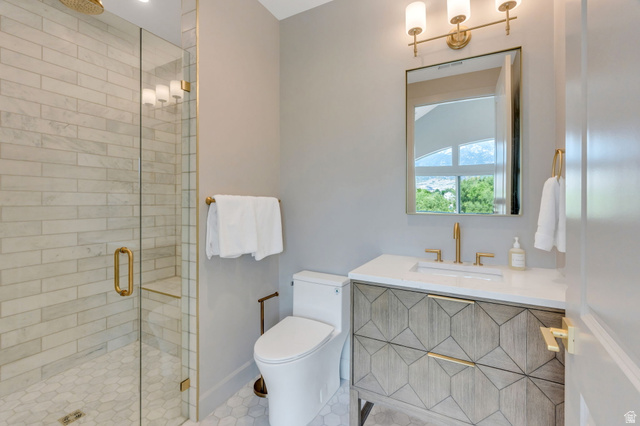 250 South Main Street, Unit 10 Alpine, UT 84004 - Photo 20 of 29 Contemporary bathroom featuring a geometric-patterned vanity with a white countertop and undermount sink