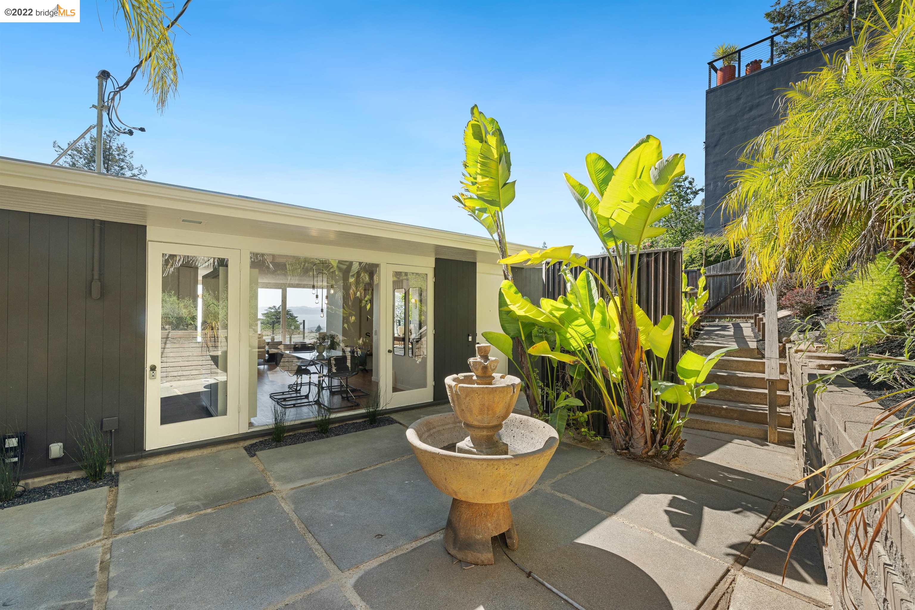 1072 Keeler Avenue Berkeley, CA 94708 - Photo 1 of 1 a view of a patio with chairs and potted plants