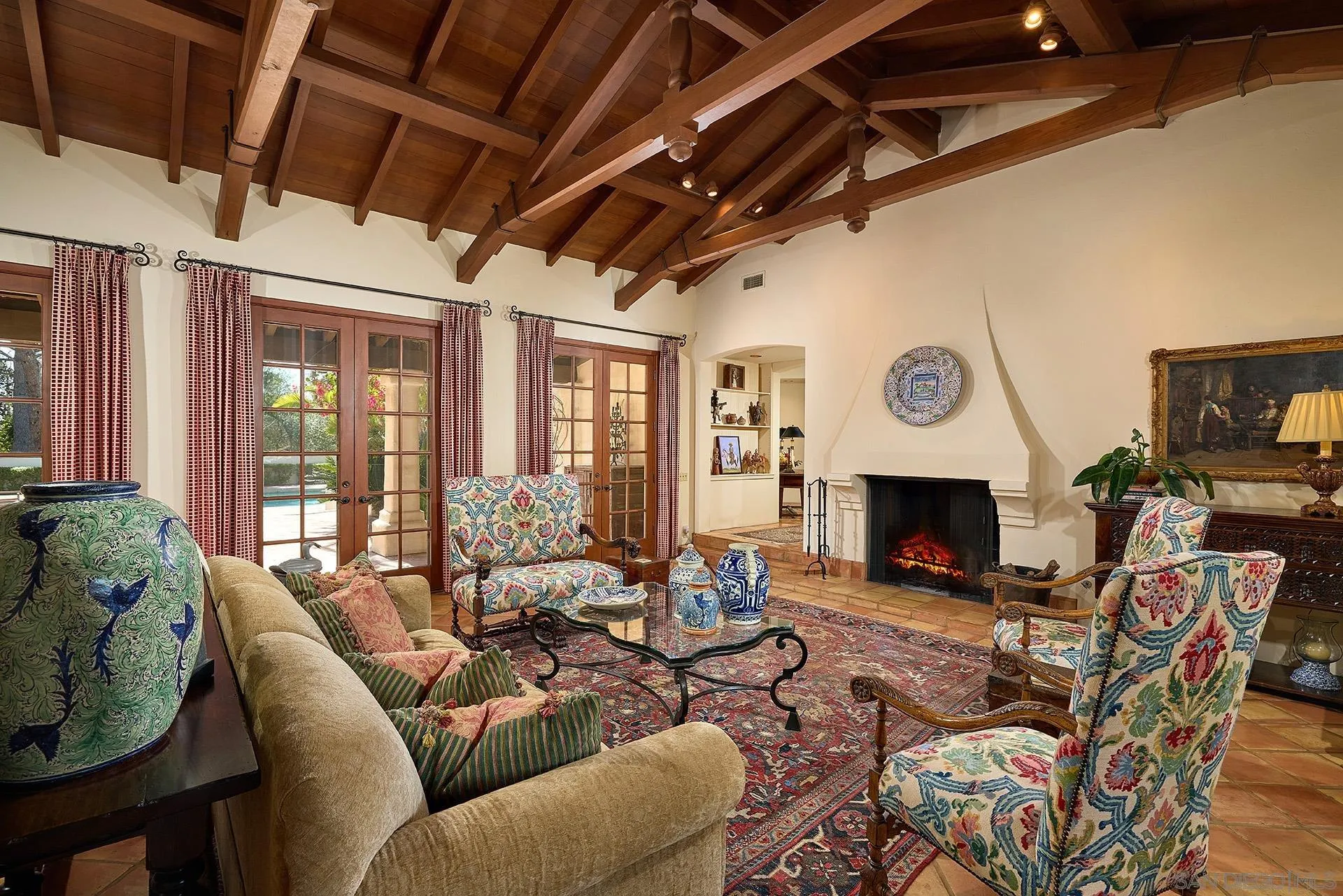 6525 Lago Lindo Rancho Santa Fe, CA 92067 - Photo 18 of 47 Dramatic living room with cathedral ceiling, exposed beams, and signature Rice fireplace