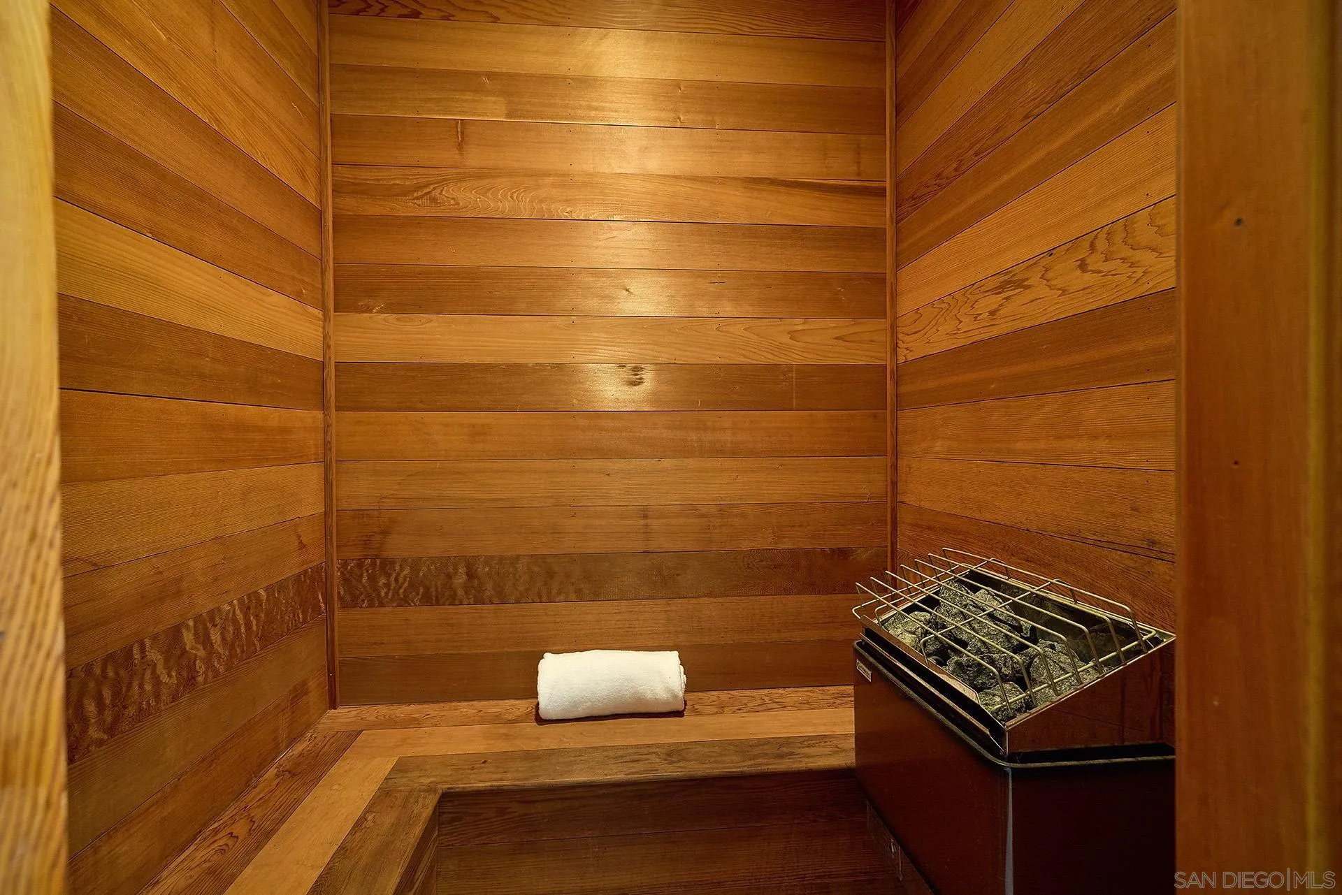 6525 Lago Lindo Rancho Santa Fe, CA 92067 - Photo 23 of 47 The gent’s bath includes a walk-in closet, a wood burning fireplace and a sauna.