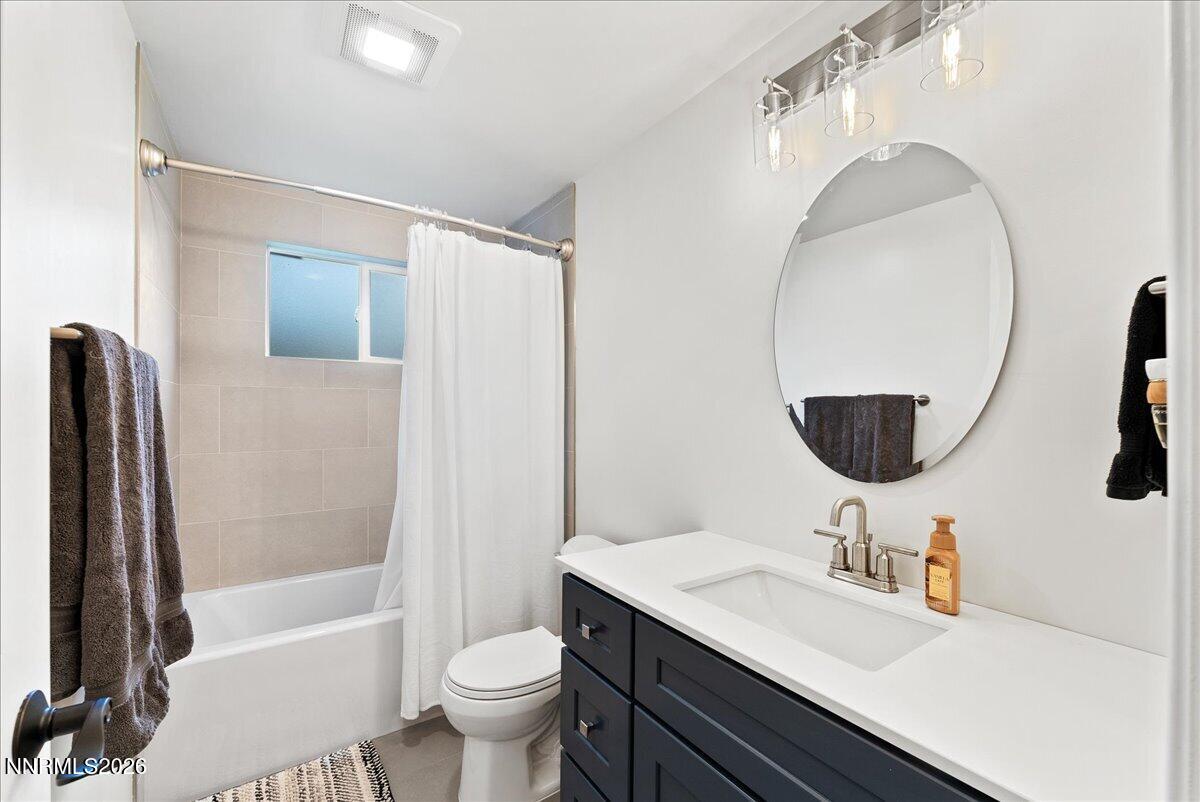 2205 Carlin Street Reno, NV 89503 - Photo 17 of 51 a bathroom with a sink toilet and shower