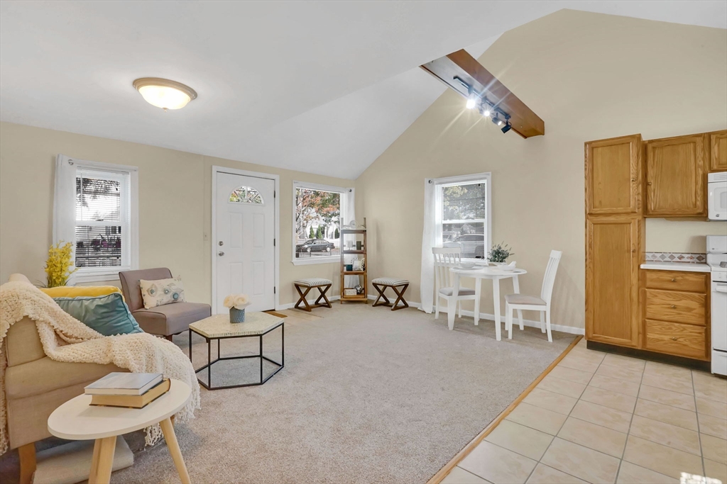 238 Merrimac Avenue Springfield, MA 01104 - Photo 13 of 37 a view of a livingroom with furniture and a couch