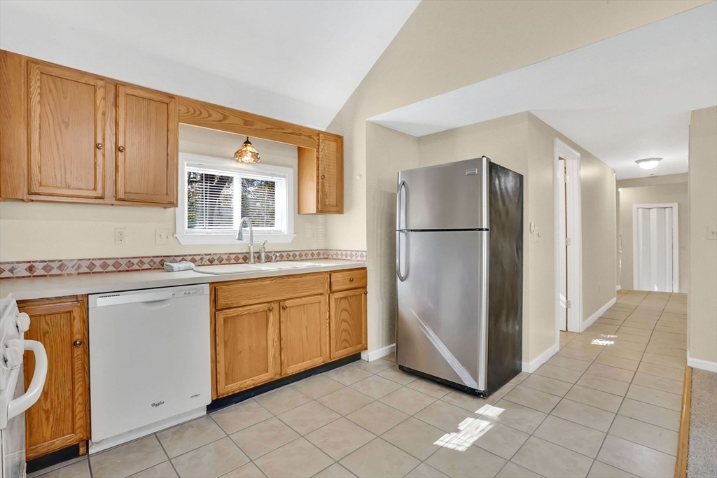 238 Merrimac Avenue Springfield, MA 01104 - Photo 16 of 37 a kitchen with stainless steel appliances granite countertop a refrigerator and a sink