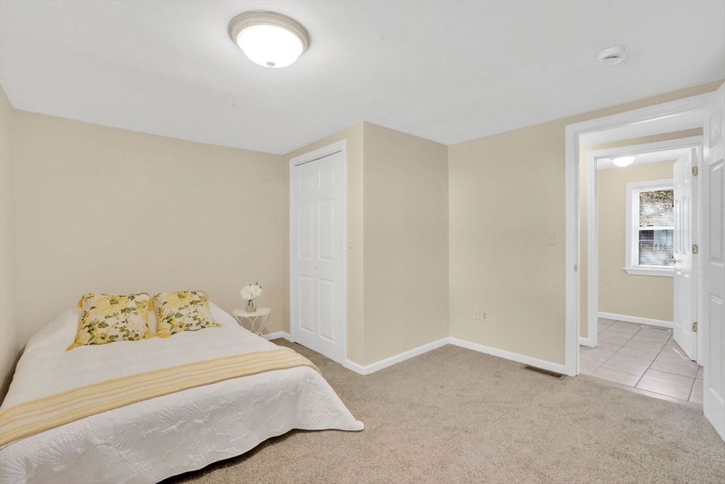 238 Merrimac Avenue Springfield, MA 01104 - Photo 26 of 37 a bedroom with a bed and a window