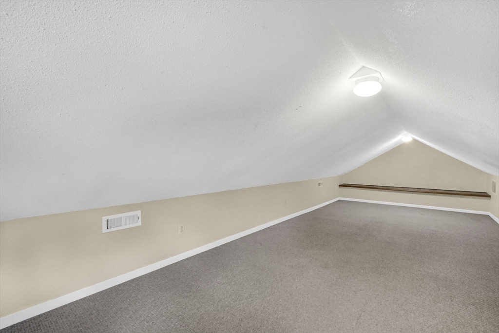 238 Merrimac Avenue Springfield, MA 01104 - Photo 31 of 37 an empty room with a ceiling fan and window