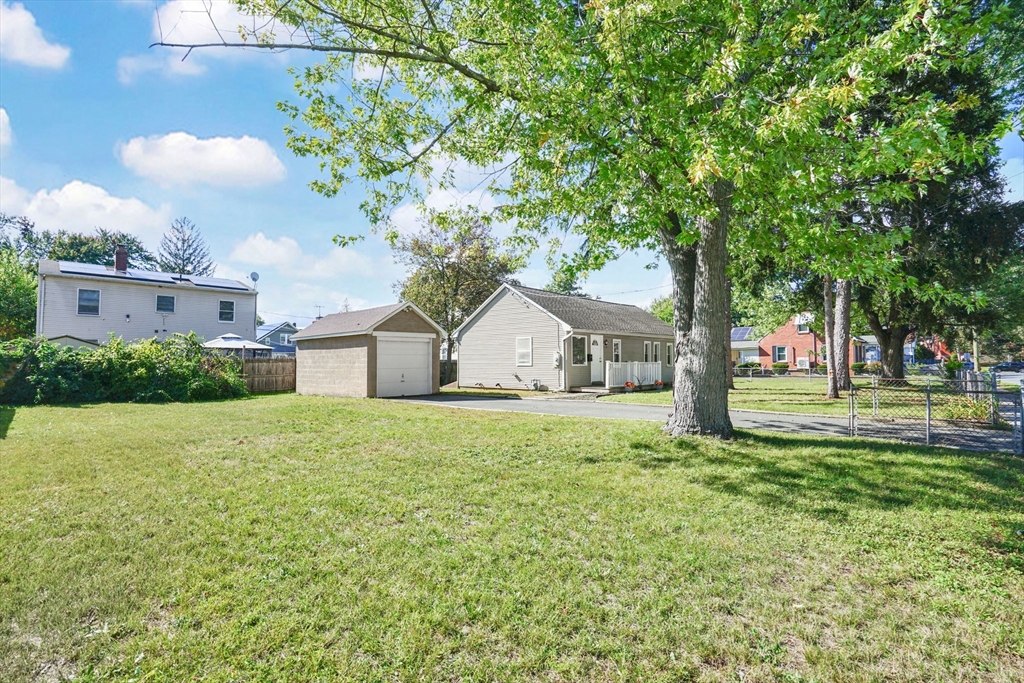 238 Merrimac Avenue Springfield, MA 01104 - Photo 8 of 37 a house with huge green field in front of it