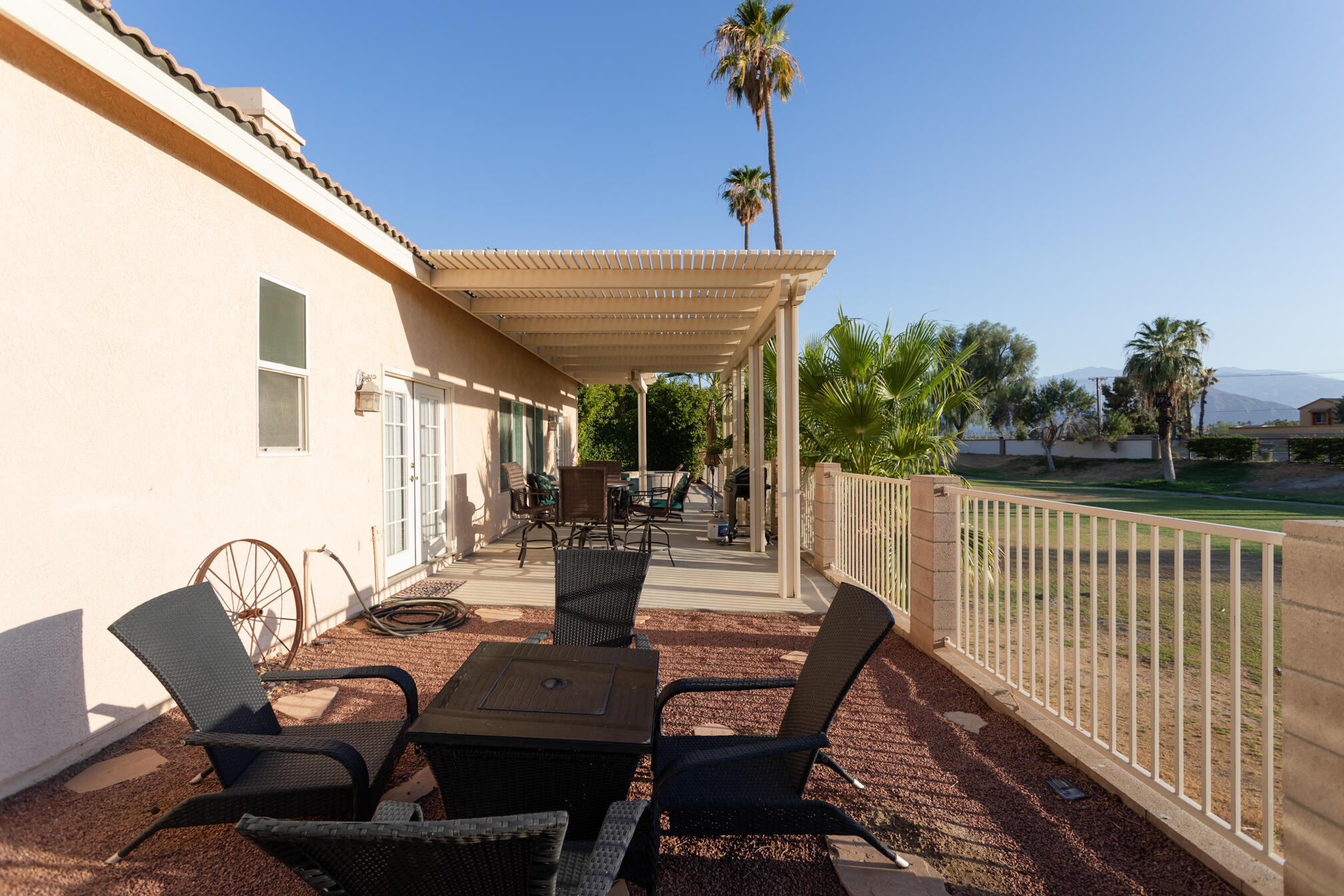 48305 Pic Way Indio, CA 92201 - Photo 11 of 80 a view of a patio with table and chairs and potted plants