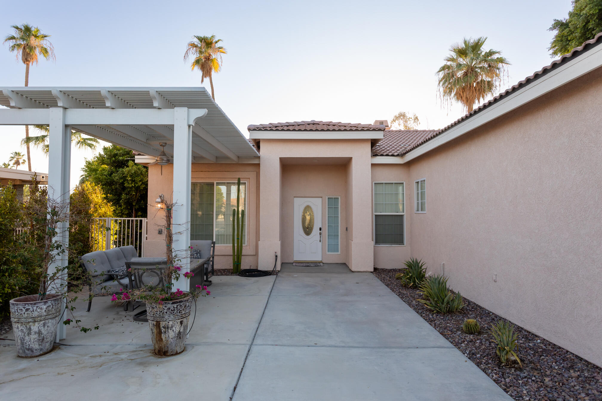 48305 Pic Way Indio, CA 92201 - Photo 12 of 80 a front view of a house with outdoor seating