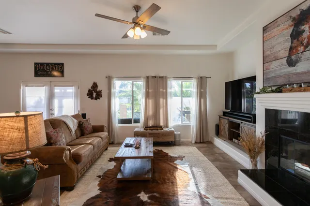 a kitchen with stainless steel appliances granite countertop a stove top oven a sink dishwasher and a microwave oven on the blue kitchen countertops