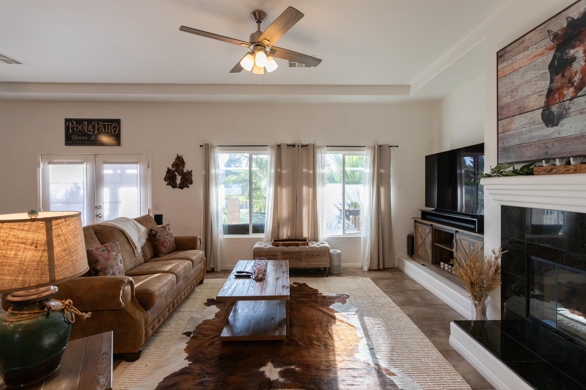 48305 Pic Way Indio, CA 92201 - Photo 25 of 80 a living room with furniture fireplace and flat screen tv