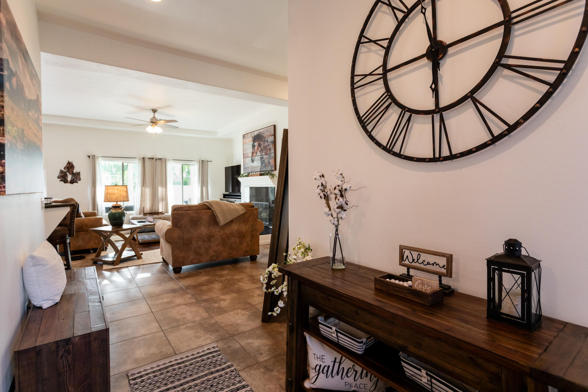 48305 Pic Way Indio, CA 92201 - Photo 28 of 80 a living room with furniture a table and a mirror