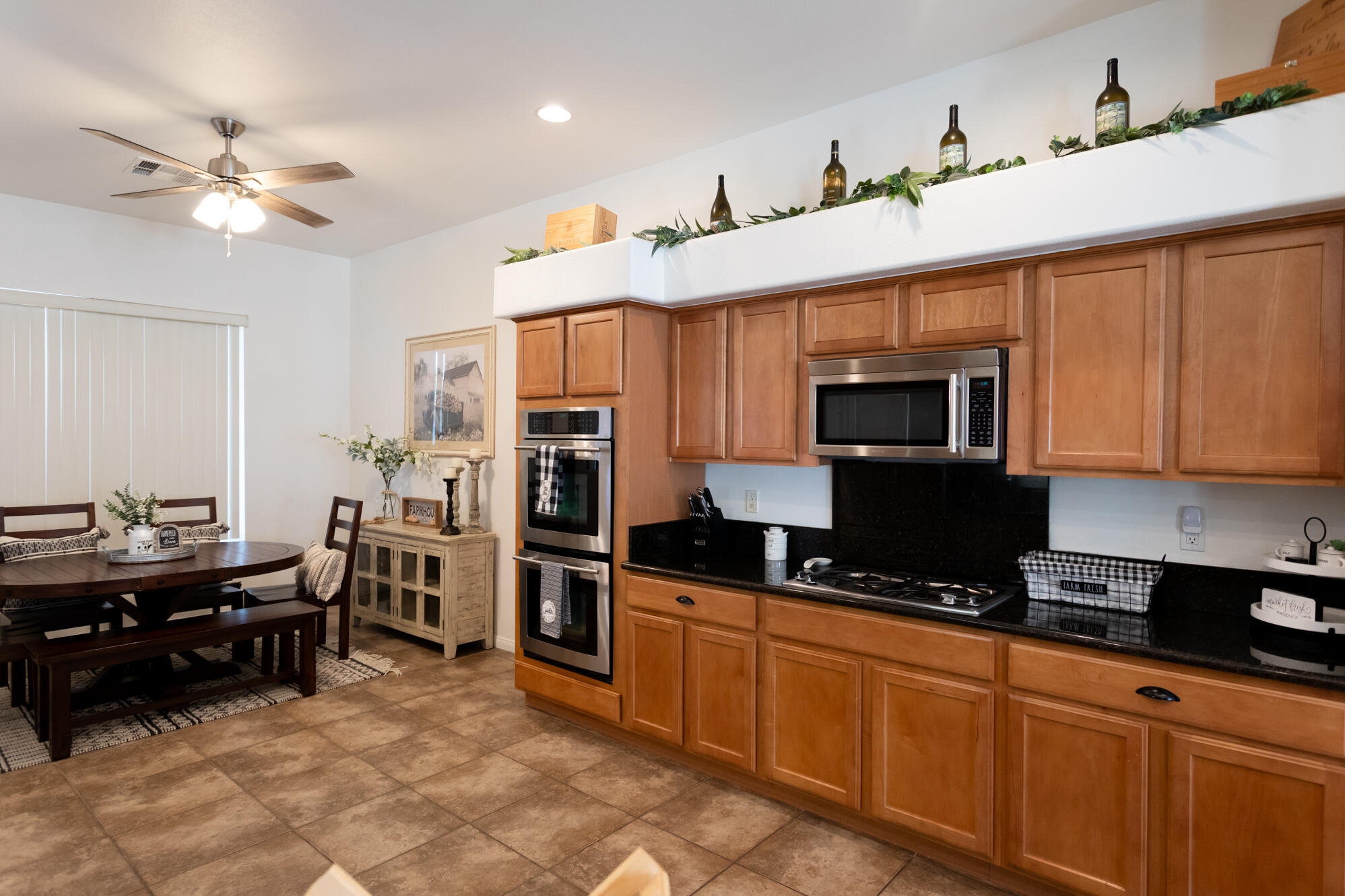 48305 Pic Way Indio, CA 92201 - Photo 29 of 80 a kitchen with stainless steel appliances kitchen island granite countertop a sink and cabinets