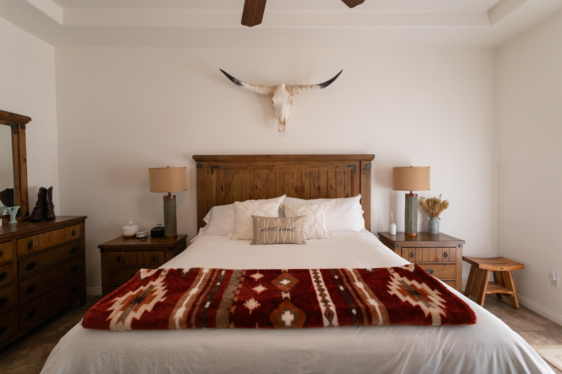 48305 Pic Way Indio, CA 92201 - Photo 48 of 80 a bedroom with a large bed and a chandelier