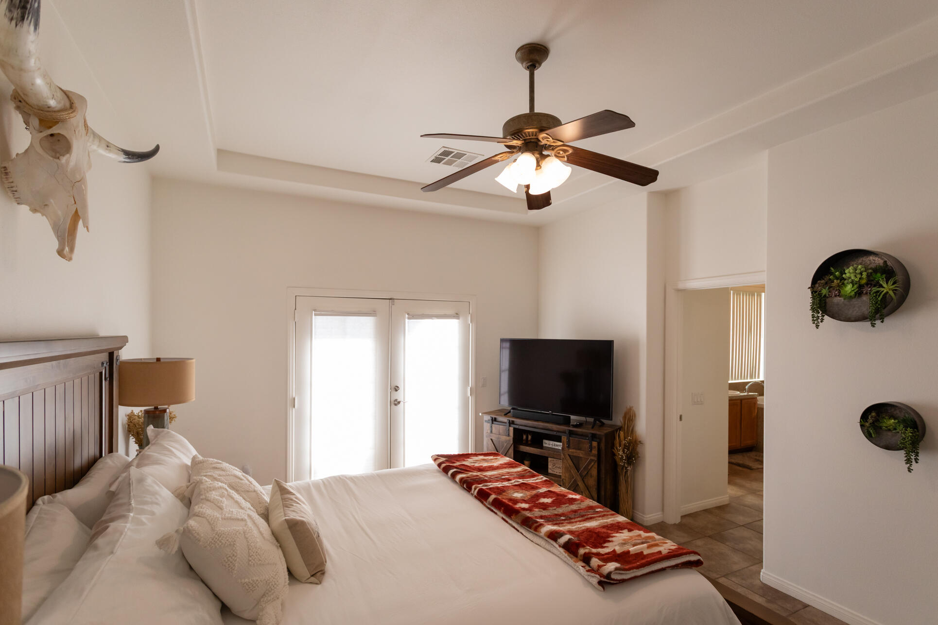 48305 Pic Way Indio, CA 92201 - Photo 56 of 80 a bedroom with a bed and a flat screen tv