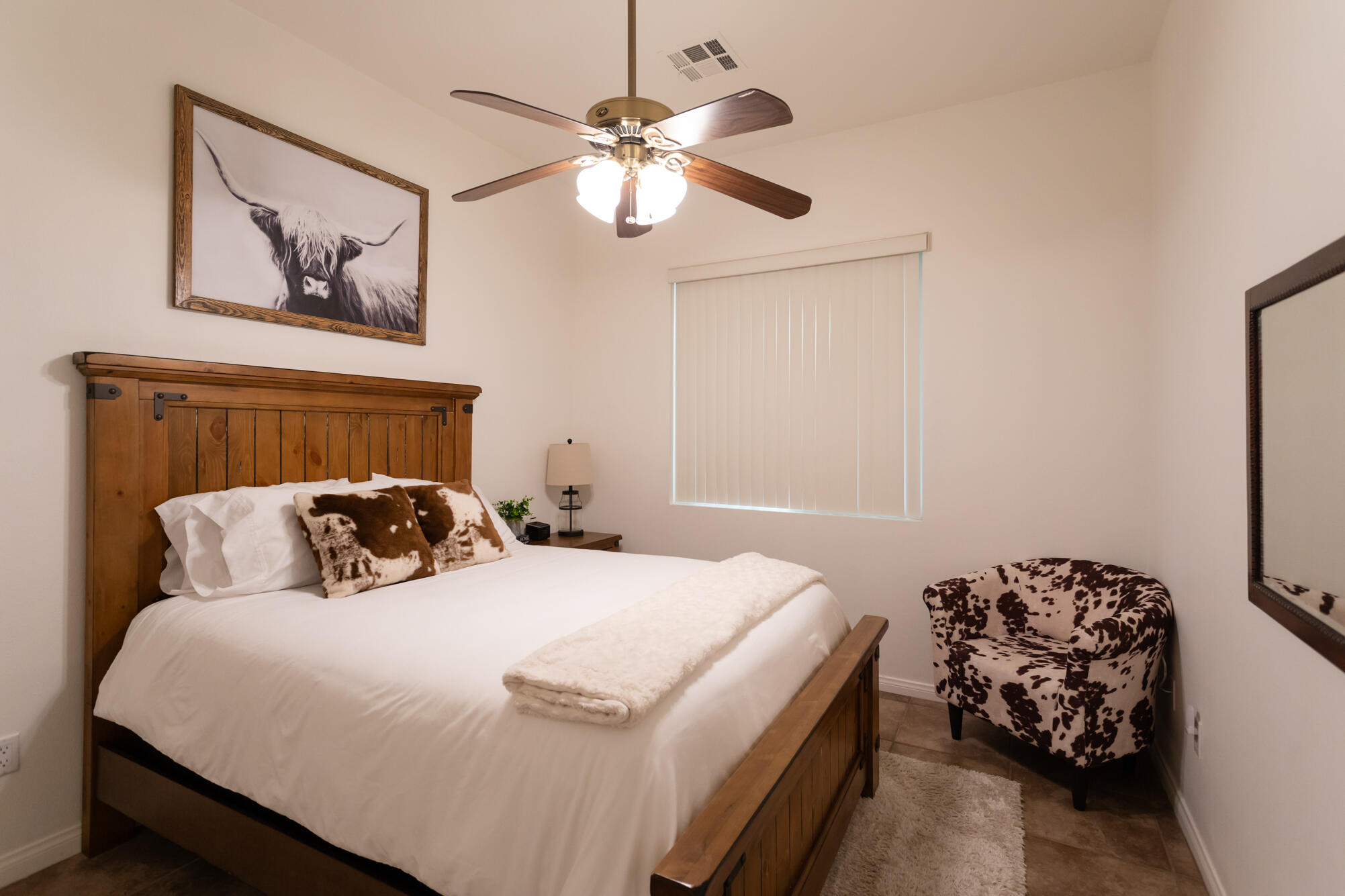 48305 Pic Way Indio, CA 92201 - Photo 63 of 80 a bedroom with a bed and a chandelier