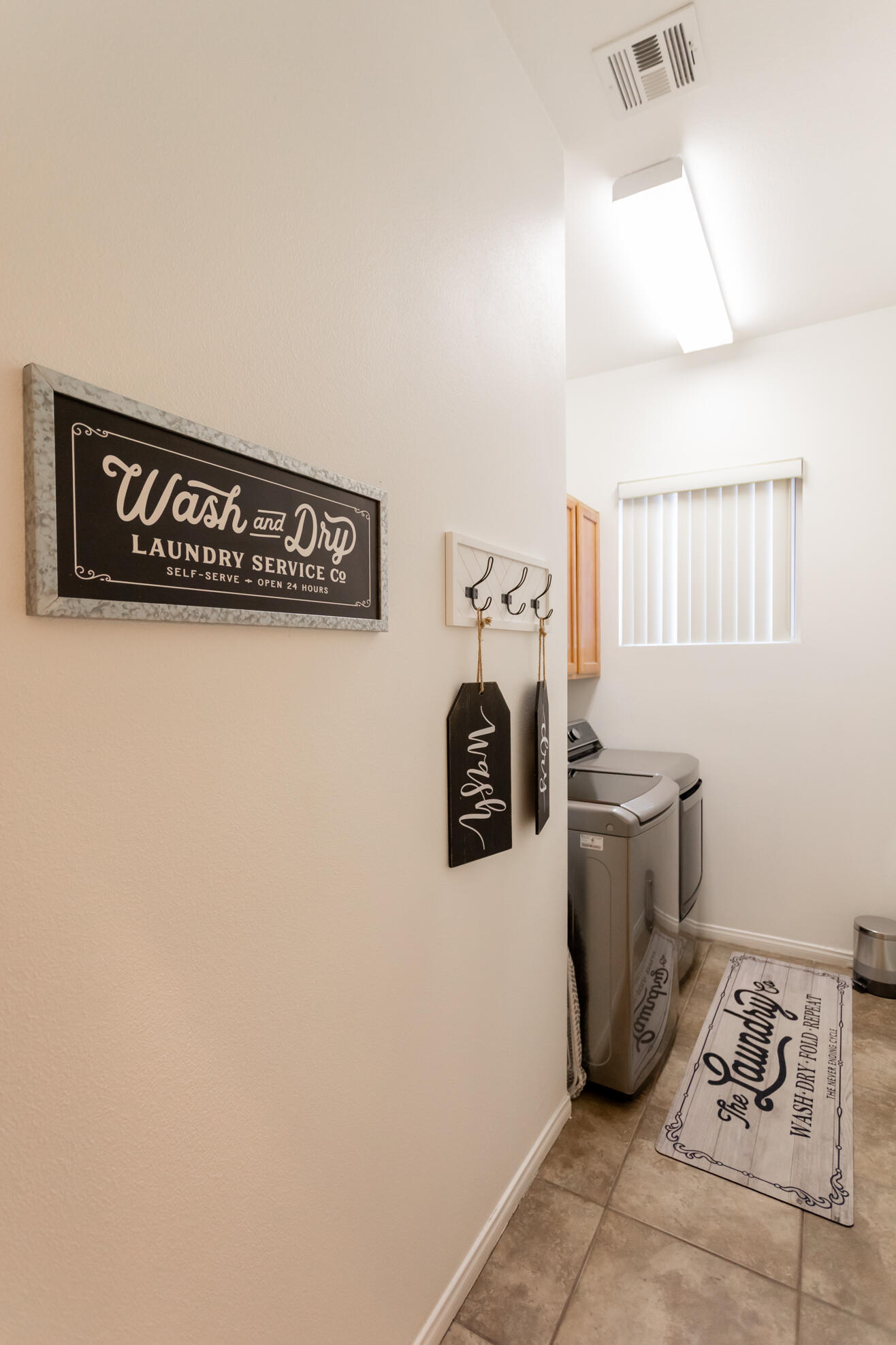 48305 Pic Way Indio, CA 92201 - Photo 72 of 80 a close view of a storage & utility room with two washing machine