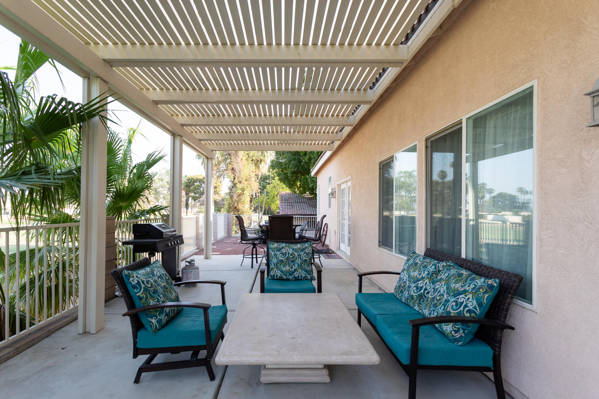 48305 Pic Way Indio, CA 92201 - Photo 79 of 80 a outdoor living space with furniture potted plant and a large window