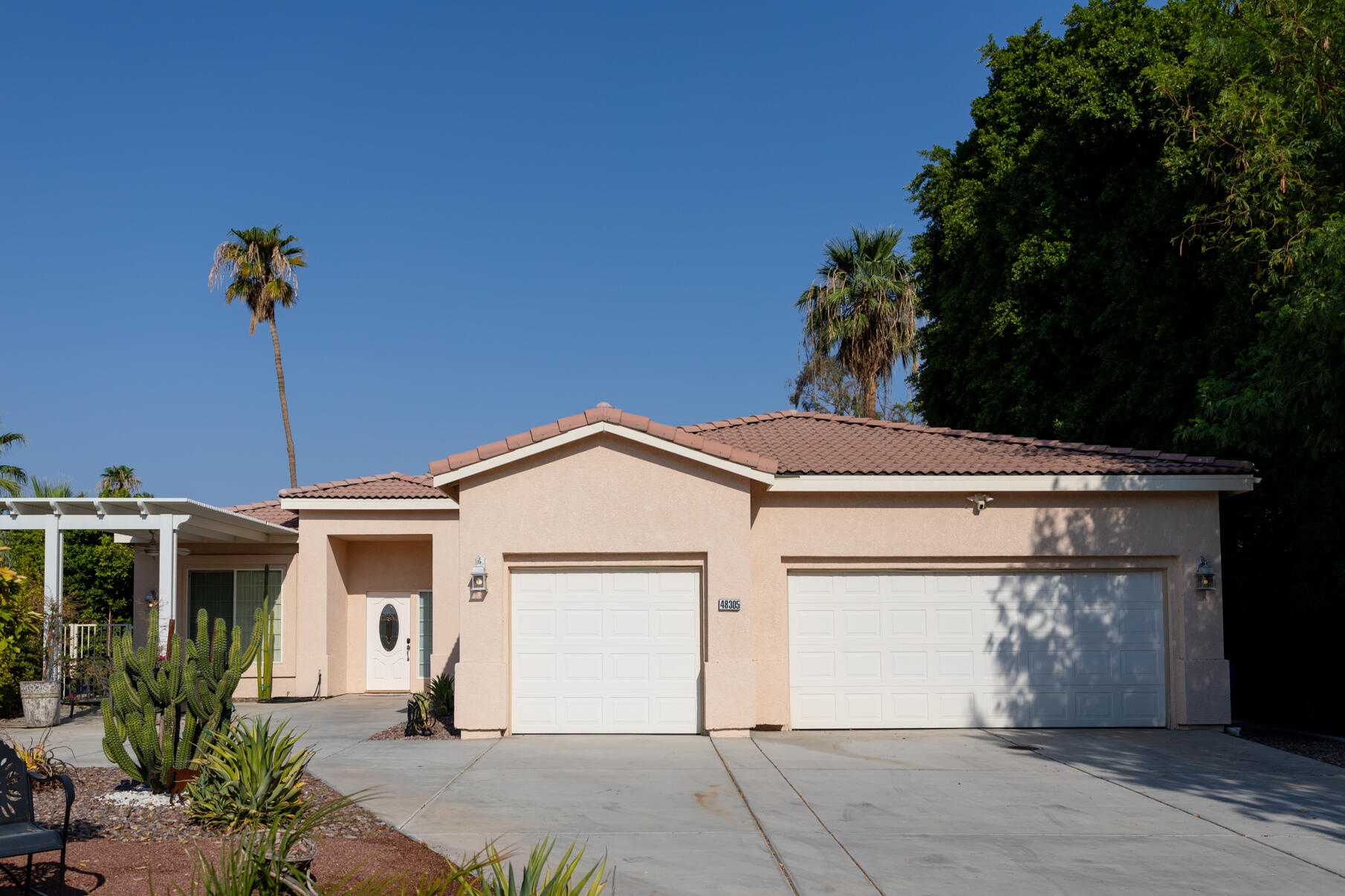 48305 Pic Way Indio, CA 92201 - Photo 80 of 80 a front view of a house with a garden