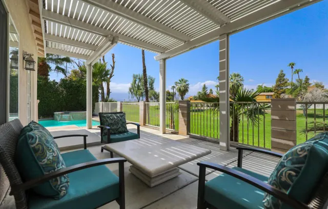 a view of a patio with a yard
