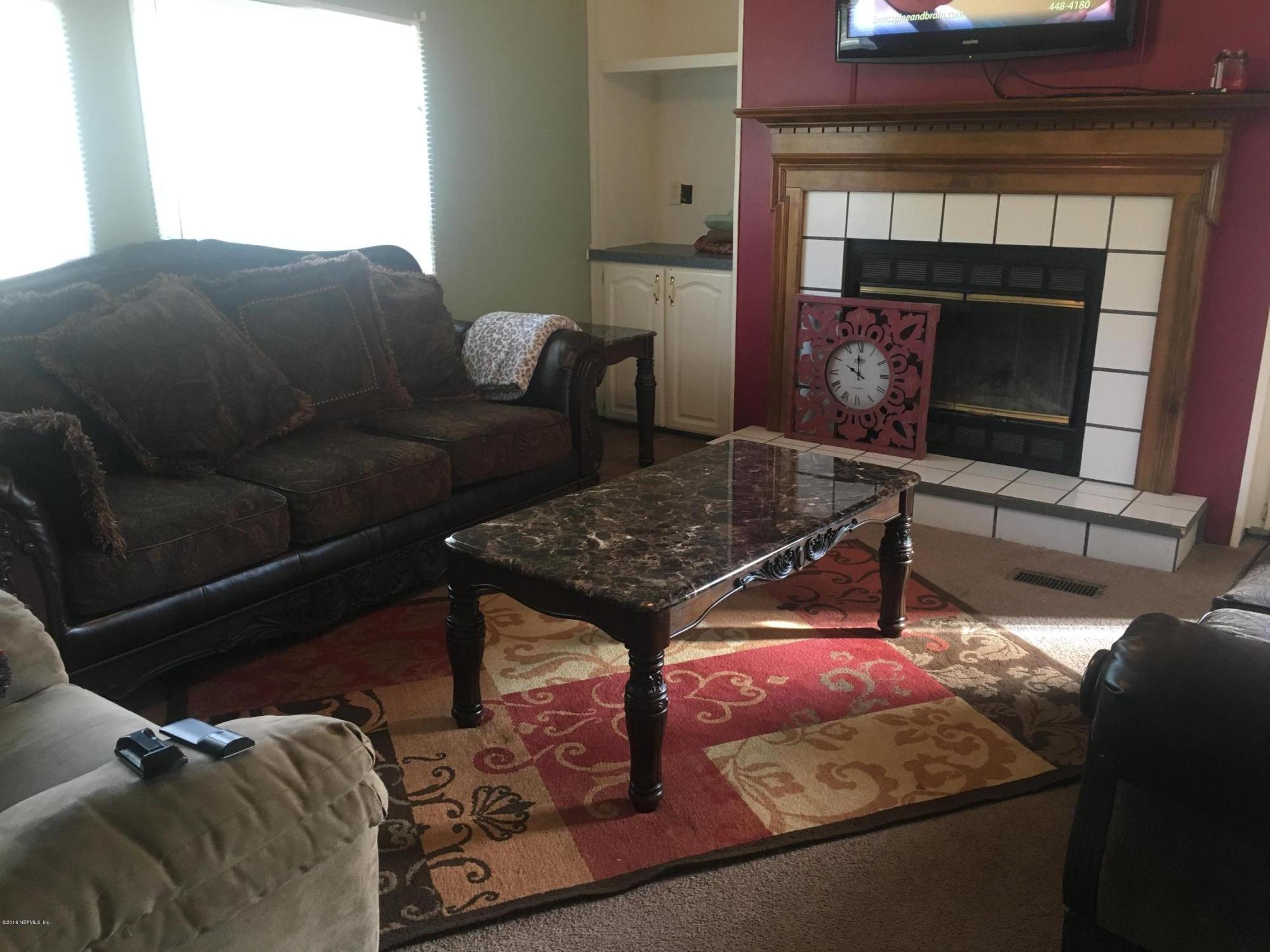 6790 Ira Starling Road Macclenny, FL 32063 - Photo 2 of 14 Family room with fireplace