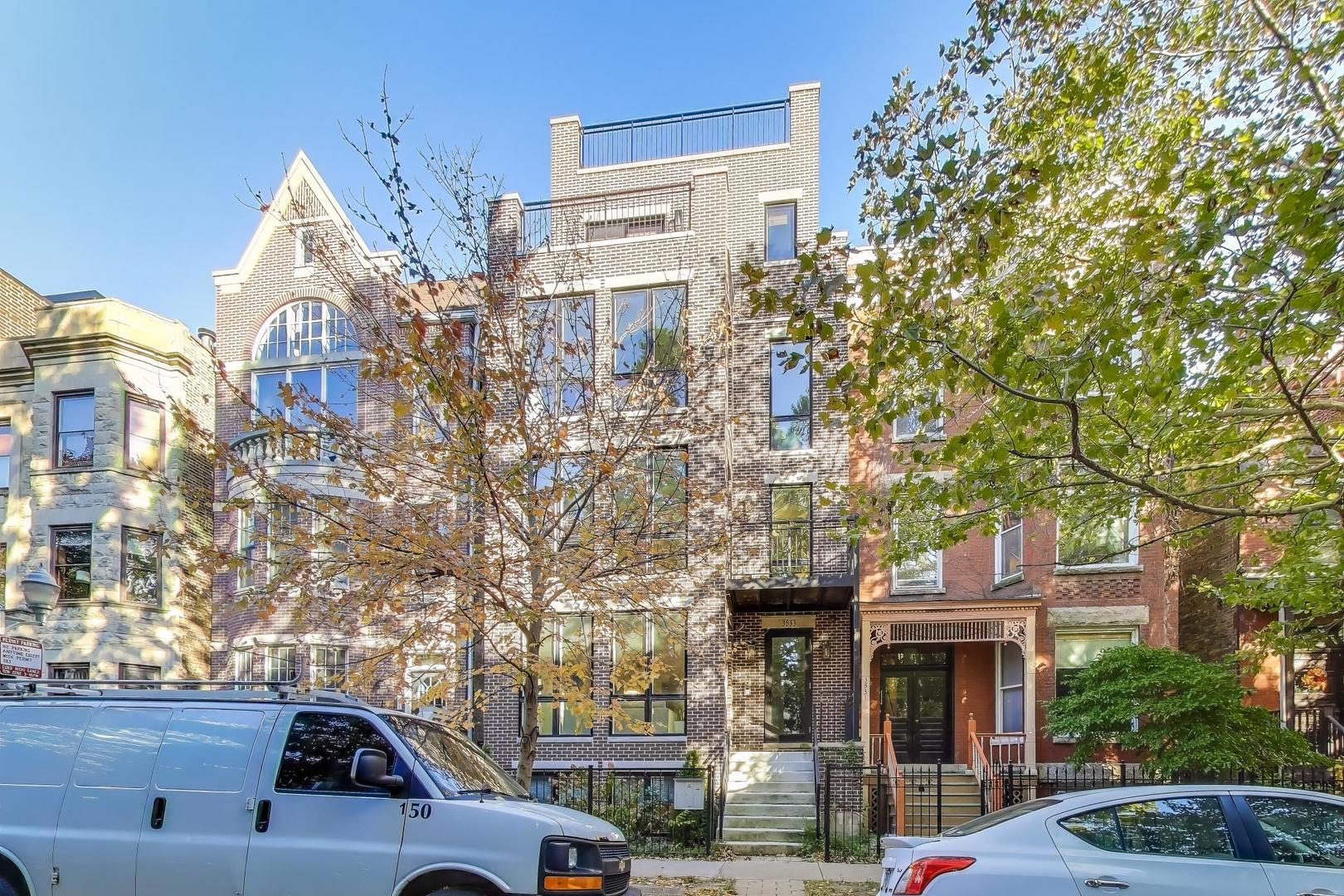 3533 North Fremont Street, Unit 2 Chicago, IL 60657 - Photo 1 of 30 a view of a building and car parked