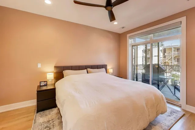 a bedroom with a bed and a mirror