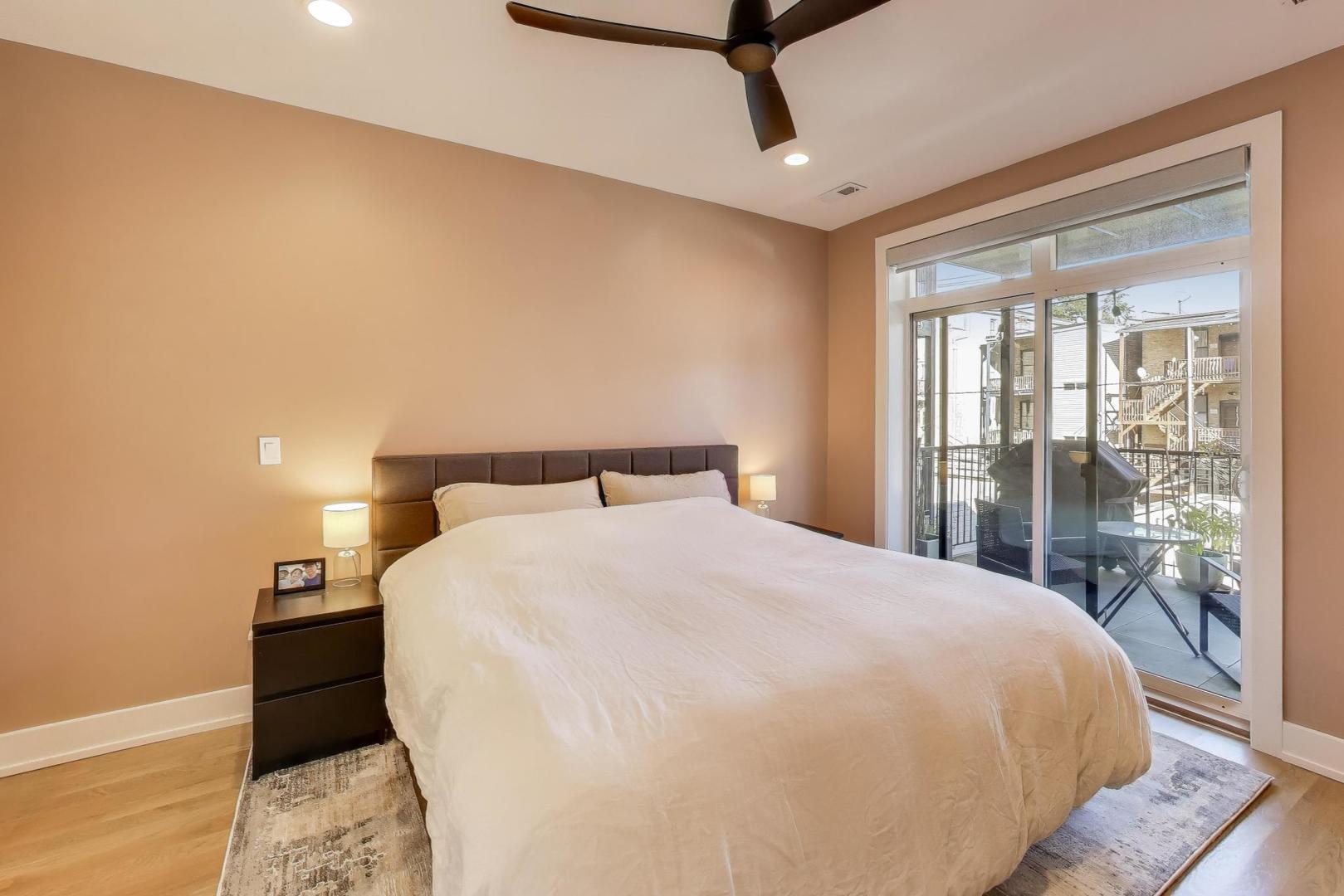 3533 North Fremont Street, Unit 2 Chicago, IL 60657 - Photo 19 of 30 a large bed sitting in a bedroom next to a window