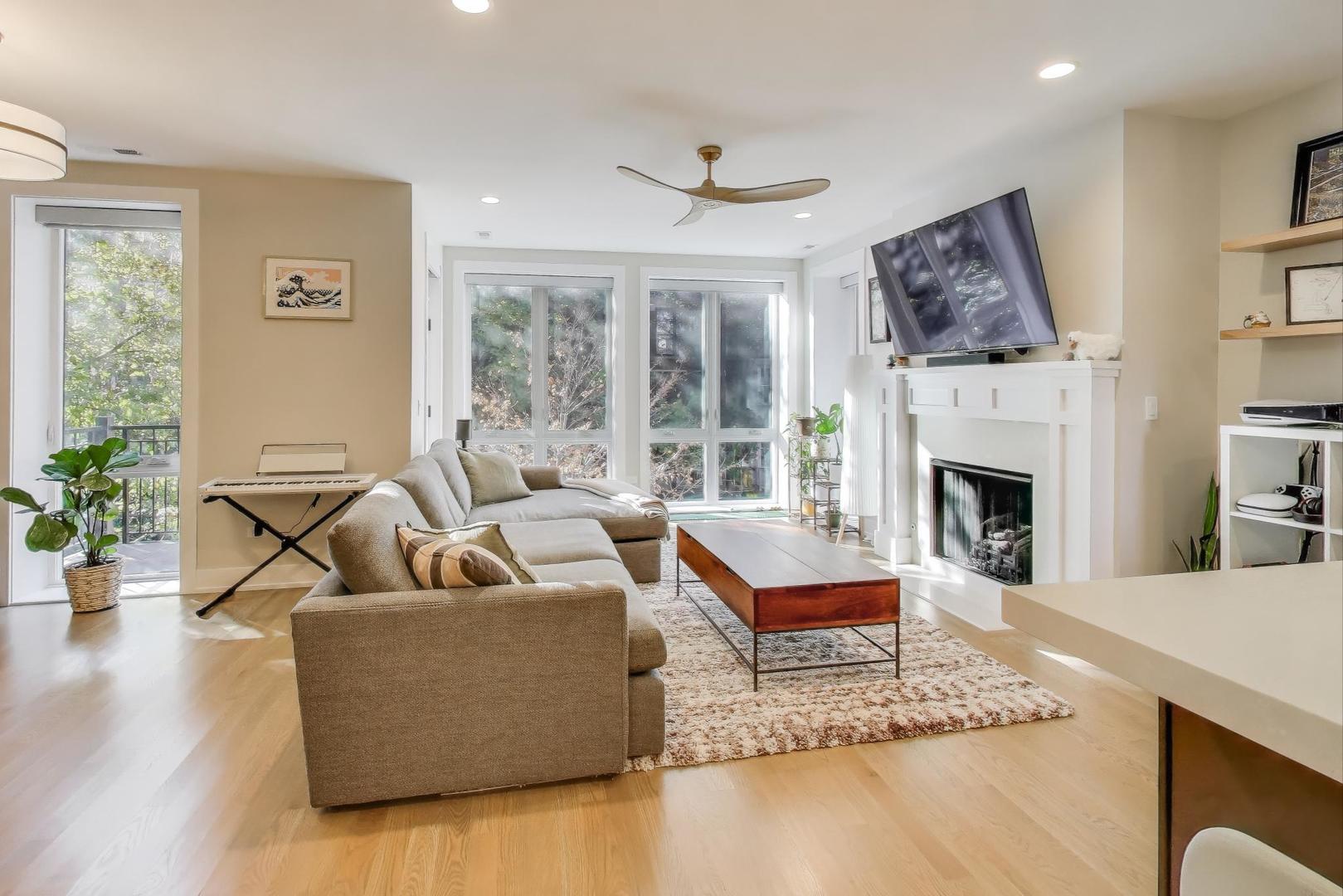 3533 North Fremont Street, Unit 2 Chicago, IL 60657 - Photo 2 of 30 a living room with furniture and a fireplace