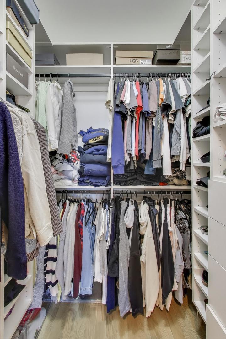 3533 North Fremont Street, Unit 2 Chicago, IL 60657 - Photo 24 of 30 a view of walk in closet with clothes and shoes
