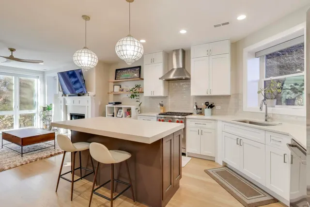 a large kitchen with a center island and appliances