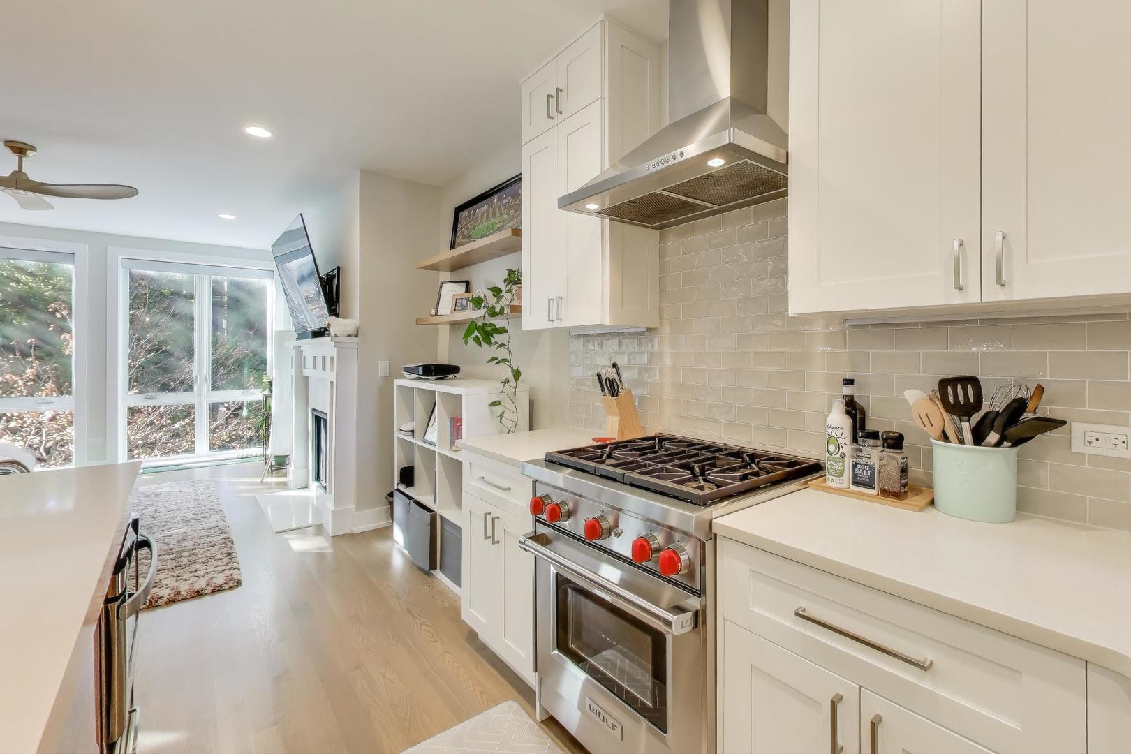 3533 North Fremont Street, Unit 2 Chicago, IL 60657 - Photo 10 of 30 a kitchen with stove and cabinets