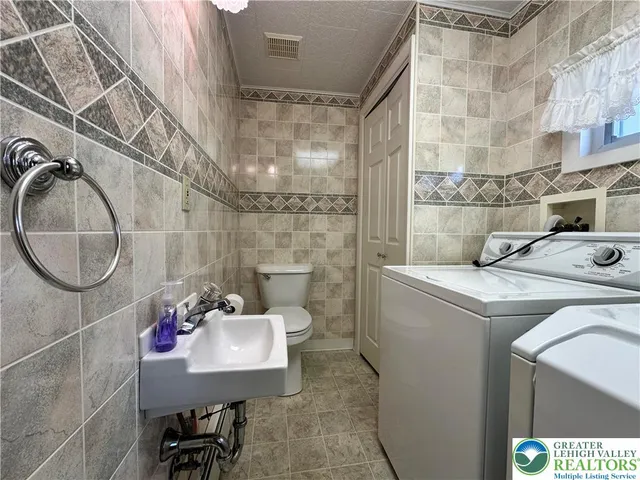 a bathroom with a sink a mirror and a shower