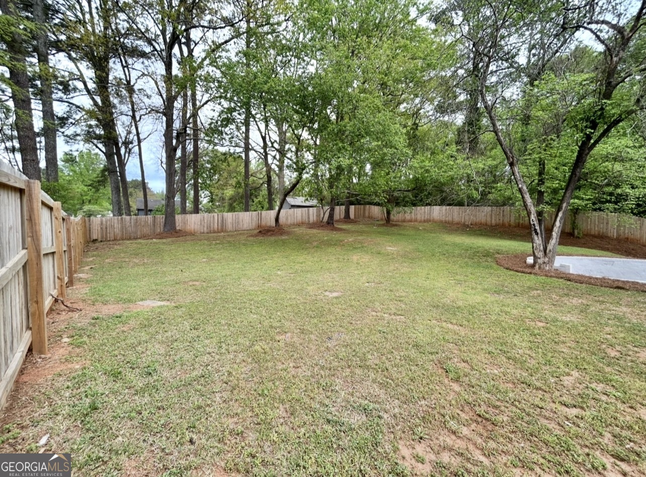 1742 Constitution Road Southeast Atlanta, GA 30316 - Photo 32 of 32 a view of a backyard with large trees