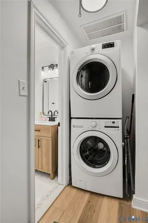 a utility room with sink dryer and washer