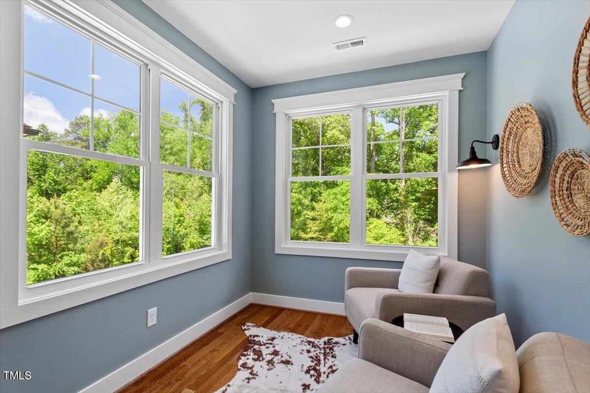 3932 Old Chapel Hill Road Durham, NC 27707 - Photo 29 of 46 a living room with furniture and a window
