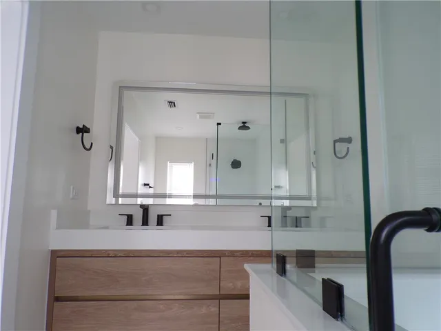 a bathroom with a bathtub and a sink