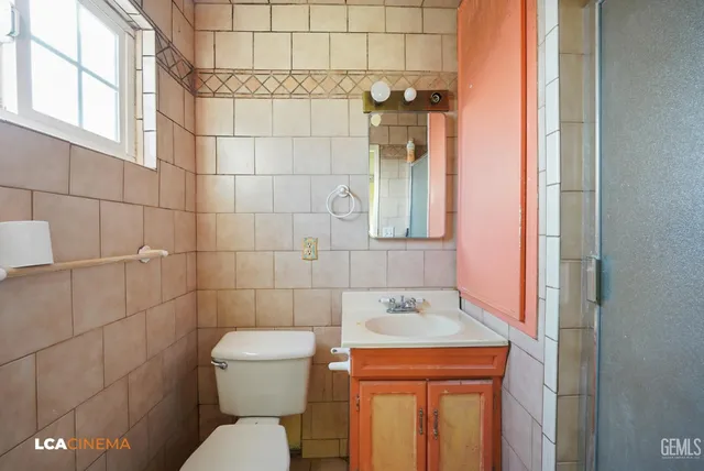 a bathroom with a sink and toilet