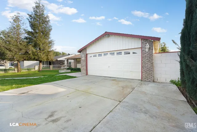 a view of garage with a tree